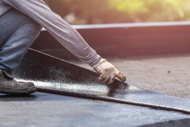 Professional Emergency Waterproofing technician working in Olivet, MI